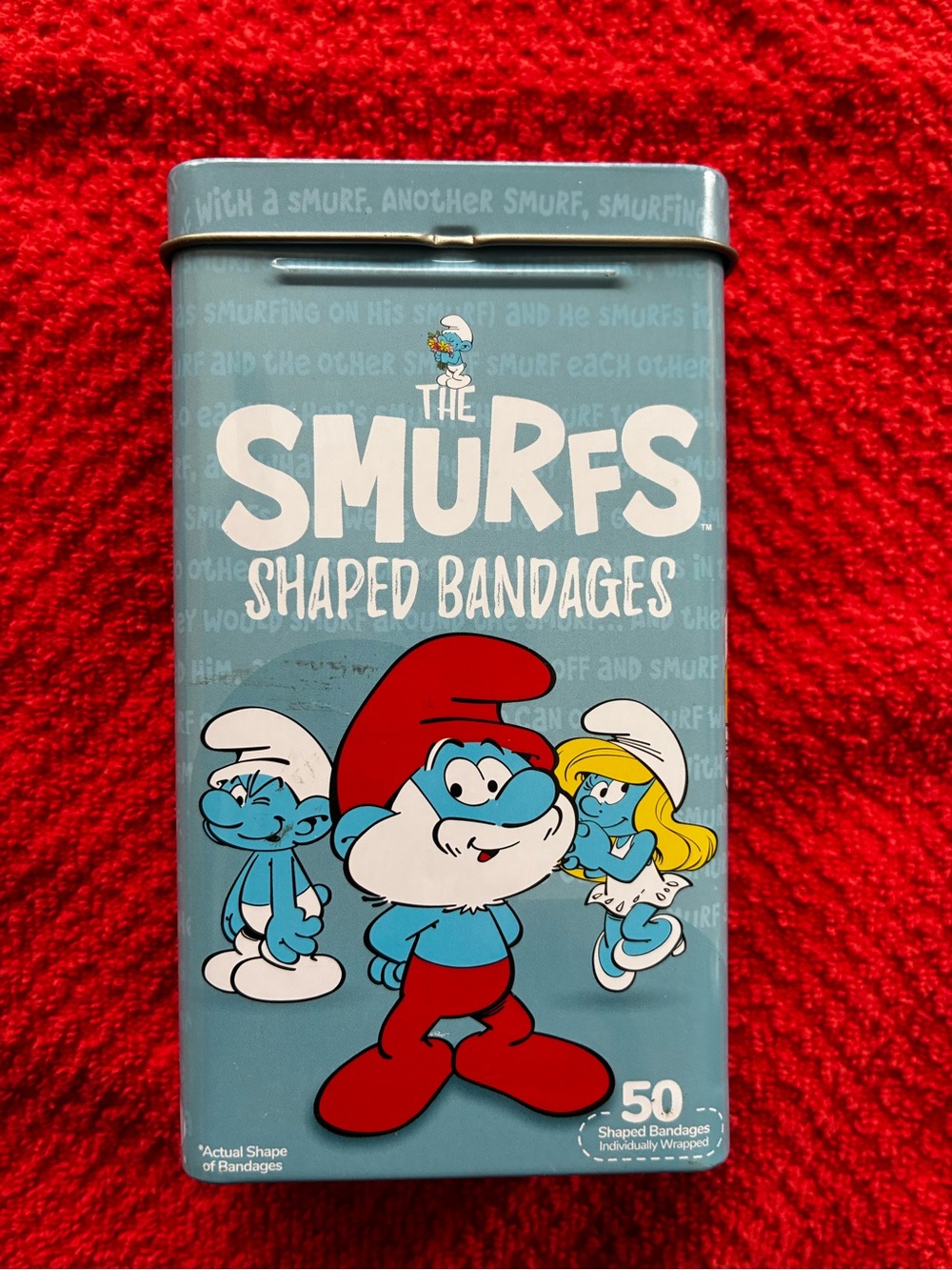 The Smurfs Shaped Bandages in Blue Metal Flip Top Box for Children of Any Age